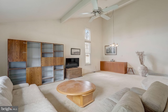 carpeted living room featuring beamed ceiling, ceiling fan with notable chandelier, and high vaulted ceiling