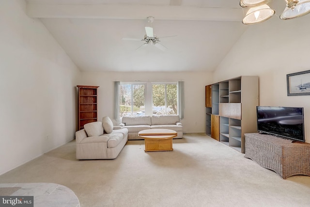 living room with carpet flooring, lofted ceiling with beams, and ceiling fan