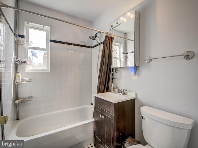 full bathroom featuring vanity, shower / bath combo, toilet, and a wealth of natural light