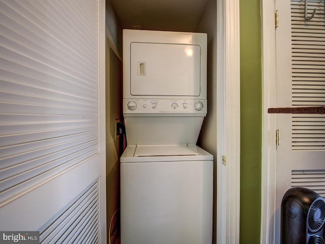 laundry area with stacked washer and clothes dryer