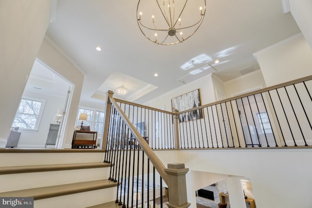 stairs featuring ornamental molding and a notable chandelier