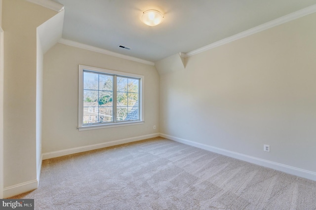 spare room with crown molding and light carpet