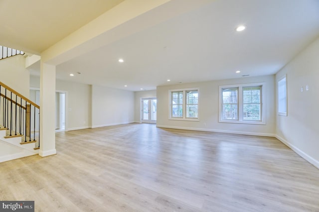 unfurnished living room featuring light hardwood / wood-style floors