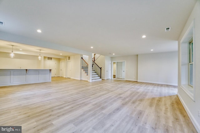 unfurnished living room featuring light hardwood / wood-style floors