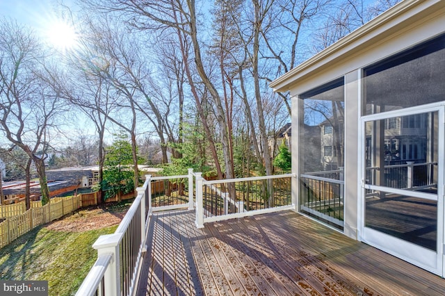 wooden terrace with a sunroom