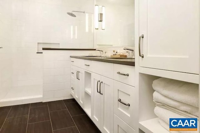 bathroom with vanity and walk in shower