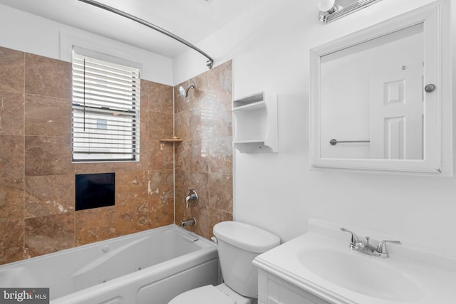 full bathroom featuring vanity, toilet, and tiled shower / bath