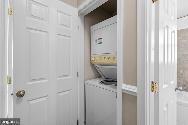 laundry room with stacked washer and dryer