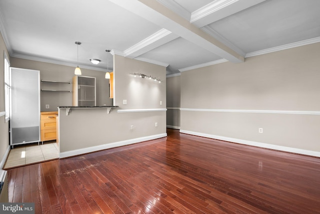 unfurnished living room featuring beam ceiling, dark wood-type flooring, and crown molding