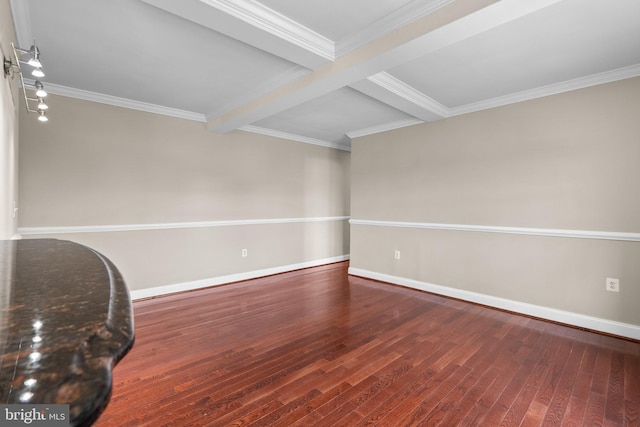 unfurnished room featuring hardwood / wood-style floors, beam ceiling, and ornamental molding