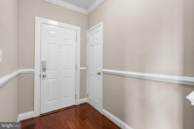 foyer featuring dark hardwood / wood-style floors and ornamental molding