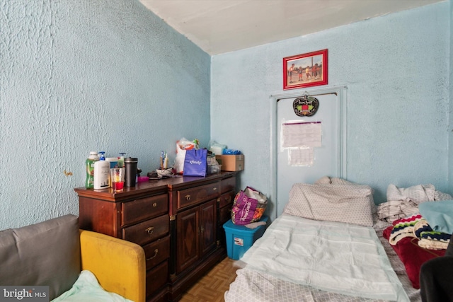 bedroom with parquet flooring