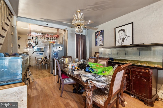 dining space featuring light hardwood / wood-style floors and ceiling fan