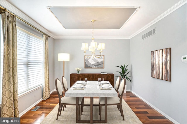 dining room featuring a chandelier, wood-type flooring, and ornamental molding