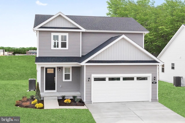 craftsman-style house with cooling unit, a garage, and a front yard