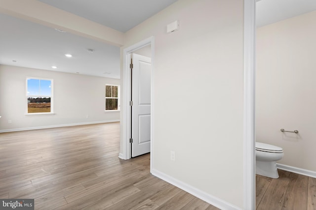 hall with light hardwood / wood-style floors