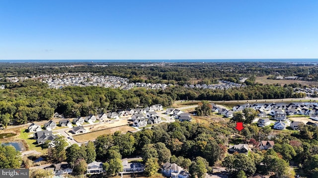 birds eye view of property with a residential view and a wooded view