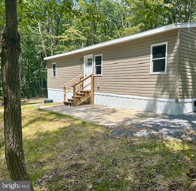 back of property featuring a patio area