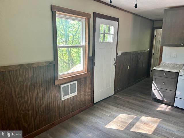 entryway with wood walls and light hardwood / wood-style floors