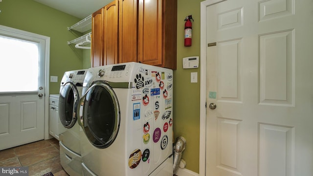 laundry area with cabinets and separate washer and dryer