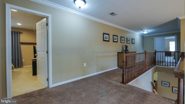 hallway featuring crown molding and light carpet