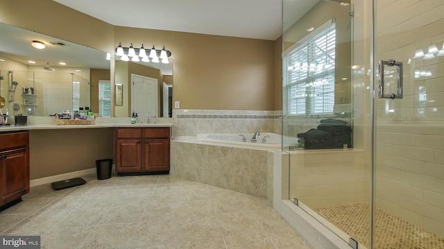 bathroom with vanity and separate shower and tub