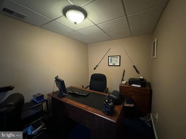 office area with a paneled ceiling