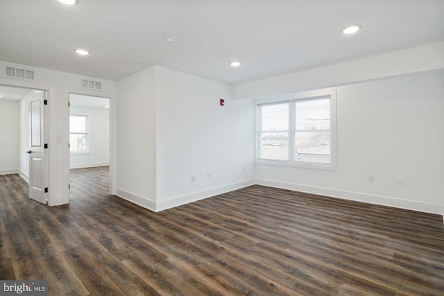 empty room featuring dark hardwood / wood-style floors