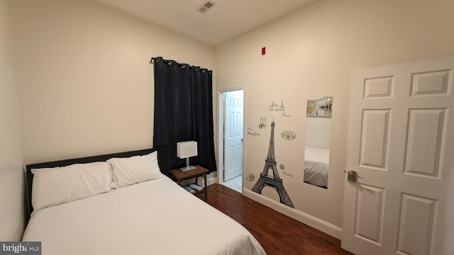 bedroom featuring dark hardwood / wood-style flooring