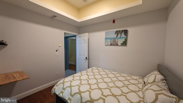 bedroom featuring dark hardwood / wood-style flooring