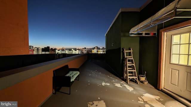 patio terrace at dusk with a balcony