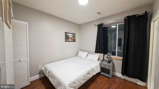 bedroom featuring dark hardwood / wood-style flooring