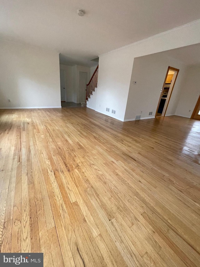 spare room with light wood-type flooring