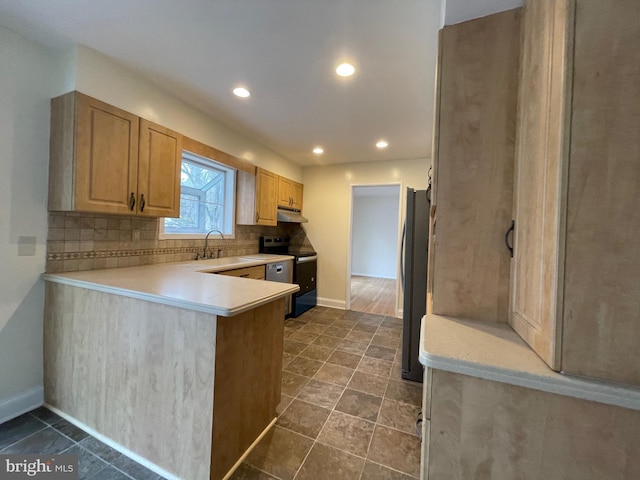 kitchen featuring kitchen peninsula, light brown cabinets, backsplash, and stainless steel appliances