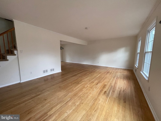 spare room featuring light hardwood / wood-style floors