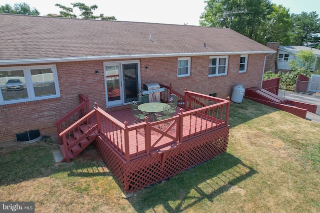 wooden deck with a yard