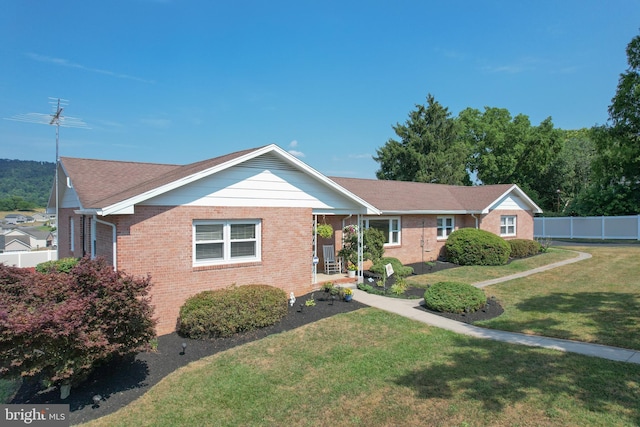 single story home featuring a front yard