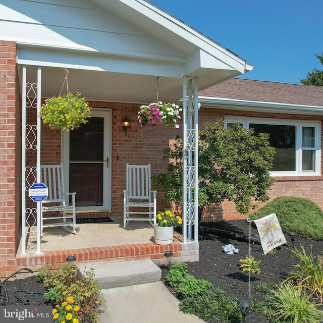 property entrance with covered porch