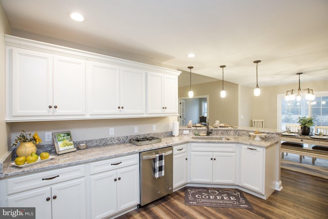 kitchen featuring white cabinets, decorative light fixtures, sink, kitchen peninsula, and stainless steel dishwasher