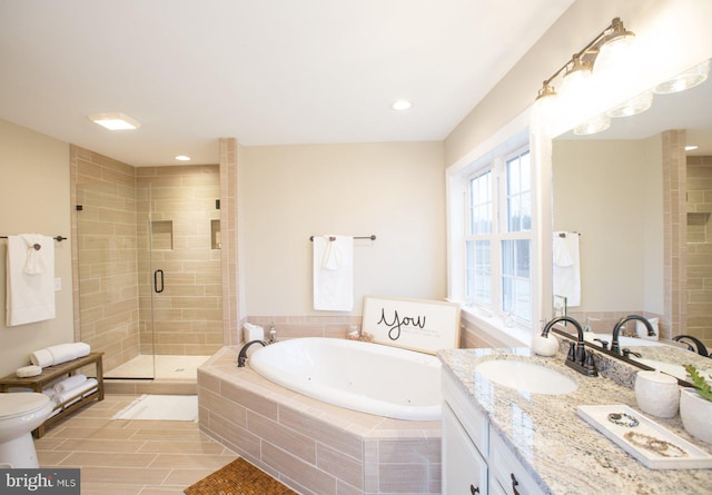 bathroom featuring vanity and plus walk in shower