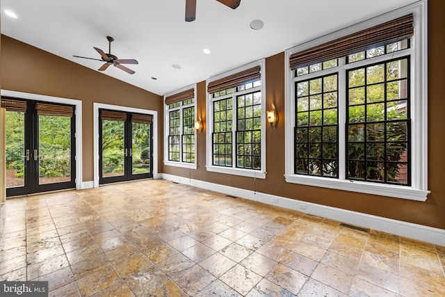 unfurnished room with ceiling fan, french doors, and lofted ceiling