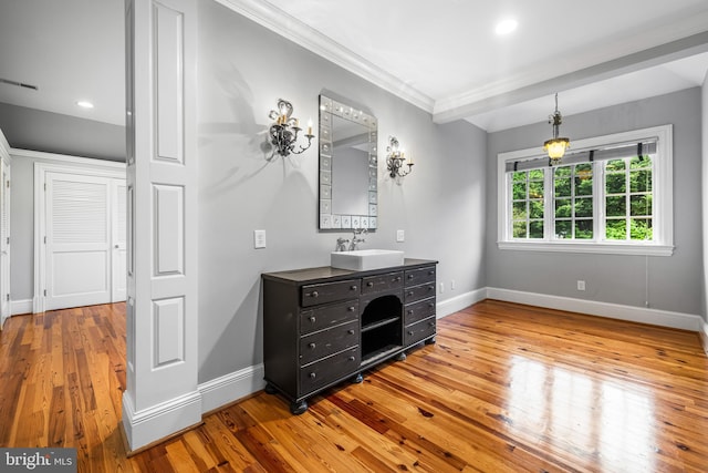 bathroom featuring hardwood / wood-style flooring and vanity