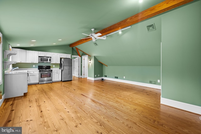 kitchen with stainless steel appliances, ceiling fan, sink, light hardwood / wood-style floors, and white cabinetry