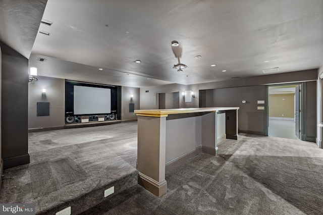 kitchen featuring carpet flooring, a center island, and a breakfast bar area