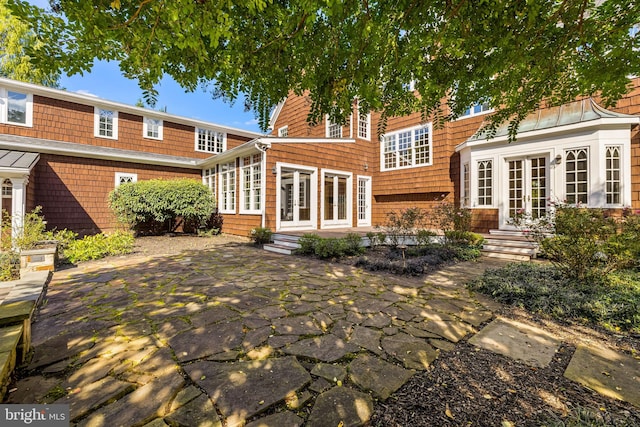 rear view of house featuring french doors and a patio