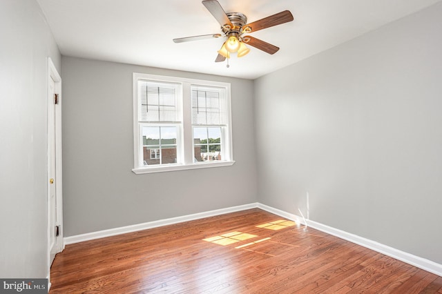 unfurnished room with wood-type flooring and ceiling fan