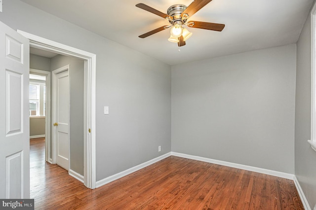 spare room with wood-type flooring and ceiling fan