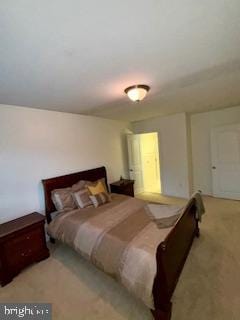 bedroom featuring light colored carpet