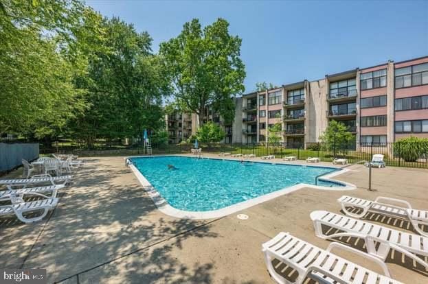 view of pool featuring a patio