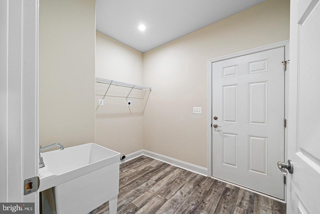 washroom with sink and hardwood / wood-style flooring